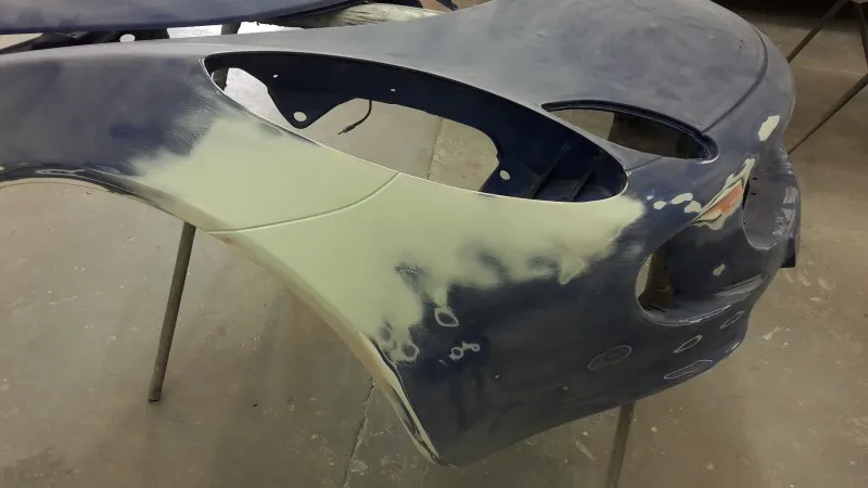 Filler applied ready for rubbing down smooth to shape of bonnet